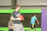 Man Preparing His Next Trampoline Dodgeball Throw